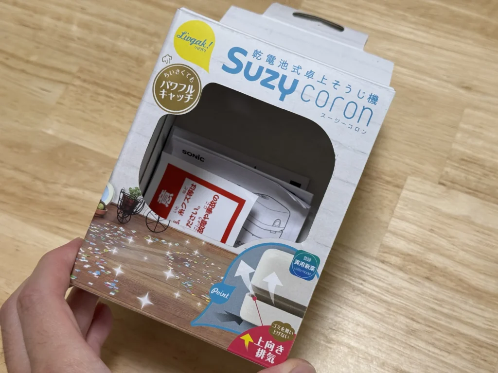 SONIC 桌上吸塵器 Suzy coron 的外盒正面,印著乾電池式卓上そうじ機